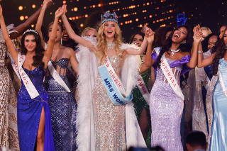 Czech Republic's Krystyna Pyszkova celebrates with other contestants after being crowned Miss World at the 71st Miss World finale in Mumbai
