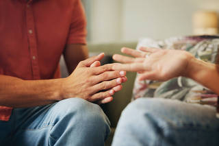 Couple, hands and living room with anxiety, stress and drama at home or apartment. Frustrated, woman and man with argument, angry and fight with toxic marriage and mistake or crisis with partner